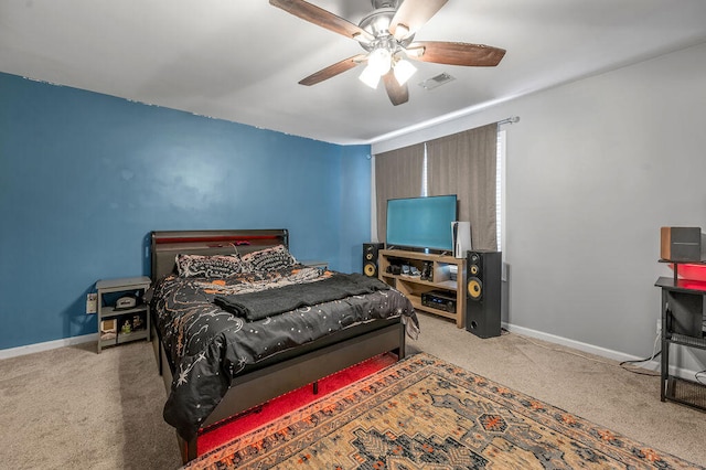 bedroom with ceiling fan and light carpet