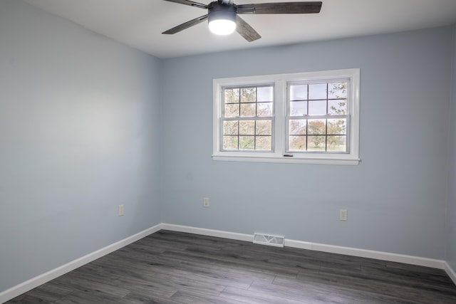 unfurnished room featuring ceiling fan and dark hardwood / wood-style flooring