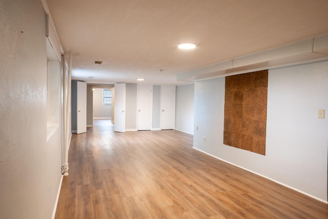 spare room featuring hardwood / wood-style flooring