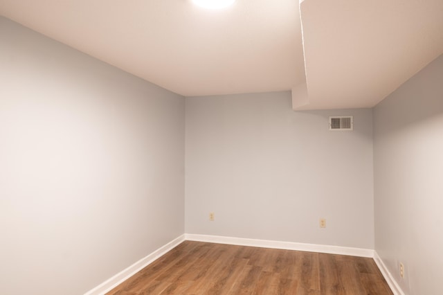 spare room featuring hardwood / wood-style floors