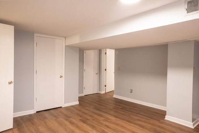 basement featuring hardwood / wood-style flooring