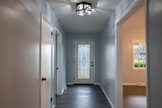 doorway with dark hardwood / wood-style floors