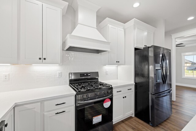 full bathroom with vanity, hardwood / wood-style flooring, washtub / shower combination, and toilet