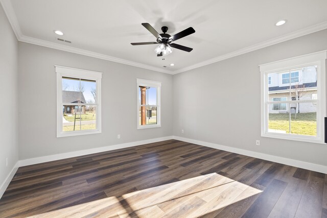 bathroom with a freestanding bath, wood finished floors, and visible vents