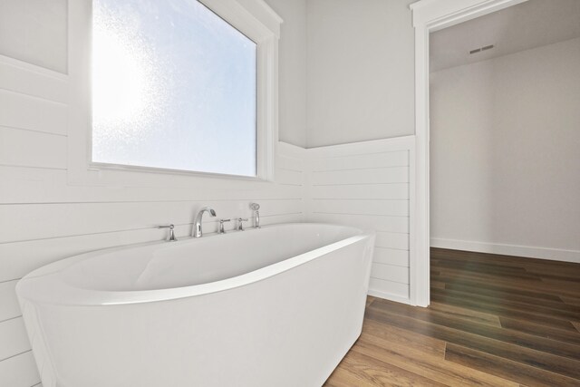 unfurnished bedroom featuring dark carpet, a ceiling fan, and baseboards