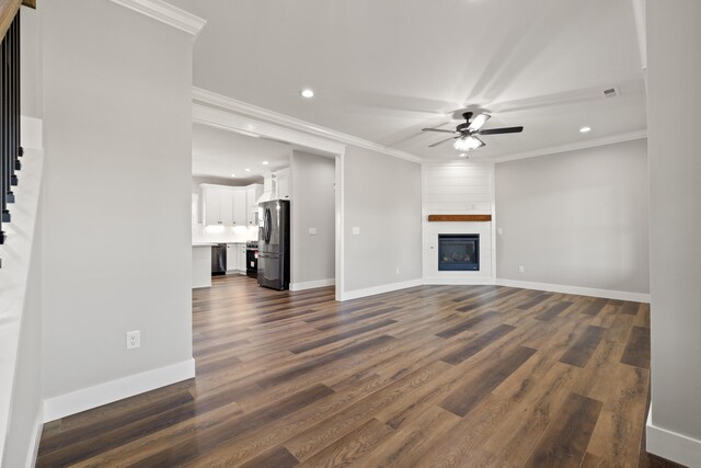 unfurnished living room featuring baseboards, visible vents, recessed lighting, ceiling fan, and dark wood-type flooring