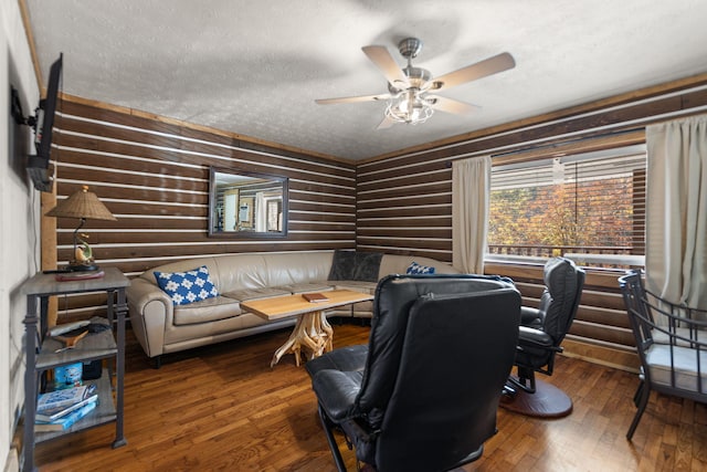 office area with ceiling fan, hardwood / wood-style floors, and a textured ceiling