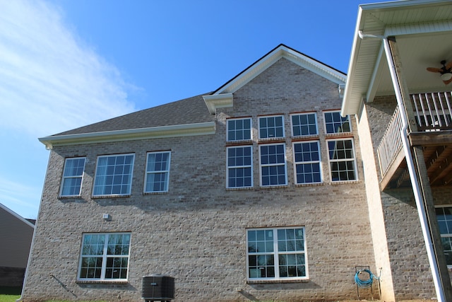 view of side of home featuring central AC unit