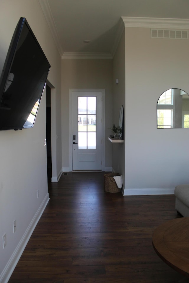 doorway featuring dark hardwood / wood-style floors and crown molding