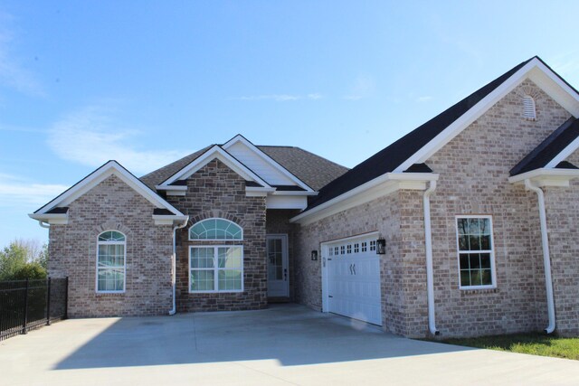 212 Patrum Sisters Way, Danville, KY 40422 - view of front of home with an attached garage, driveway, fence, and brick siding