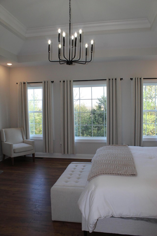 bedroom with ornamental molding, a chandelier, and dark hardwood / wood-style floors