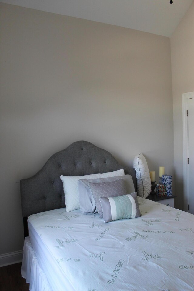 212 Patrum Sisters Way, Danville, KY 40422 - bedroom featuring vaulted ceiling, dark wood finished floors, and baseboards