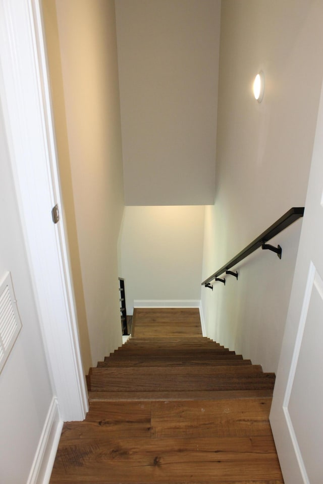 stairway featuring hardwood / wood-style floors