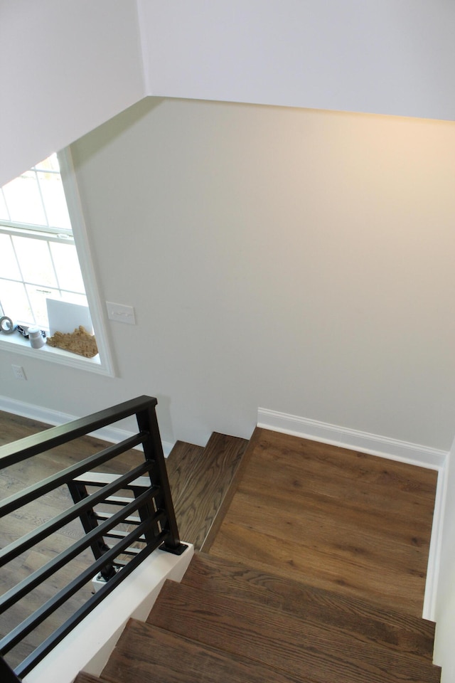 stairway featuring hardwood / wood-style flooring