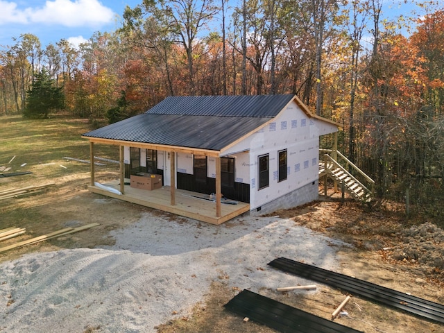 exterior space with a porch and a front lawn