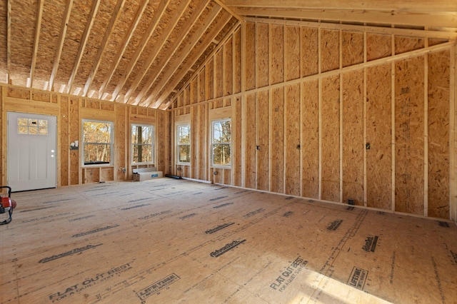 miscellaneous room featuring high vaulted ceiling