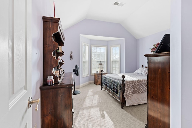 carpeted bedroom with visible vents, baseboards, and vaulted ceiling