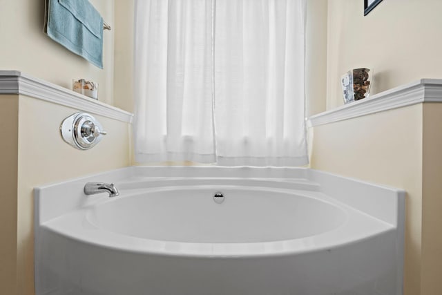 bathroom with a garden tub