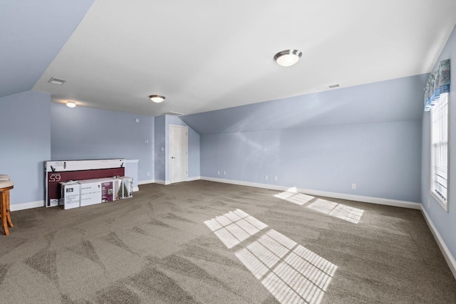 bonus room with visible vents, carpet, lofted ceiling, and baseboards