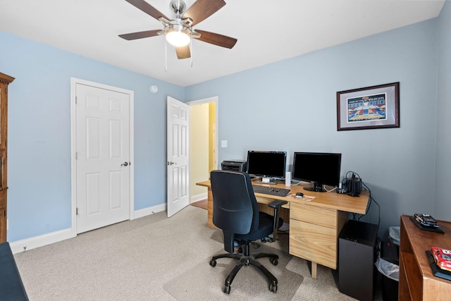 office with light colored carpet, baseboards, and ceiling fan