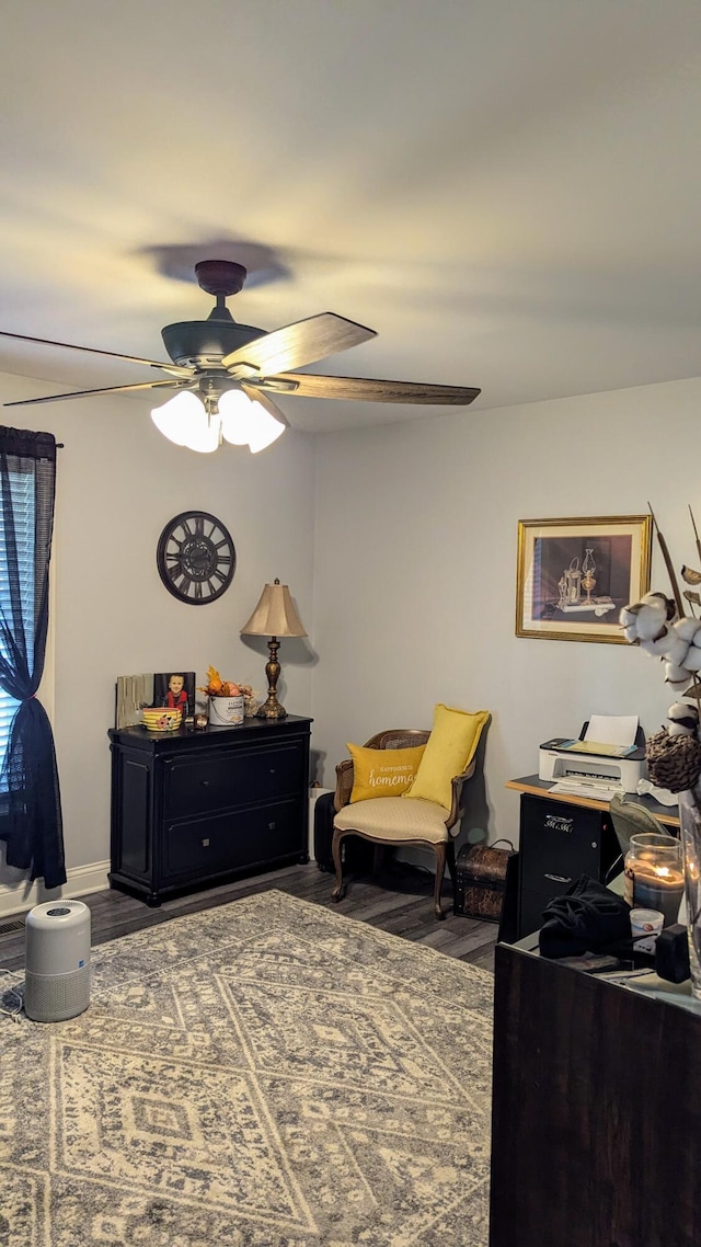 interior space with ceiling fan and wood-type flooring