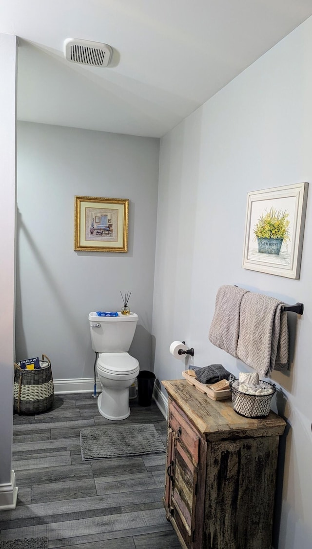 bathroom featuring toilet and hardwood / wood-style floors