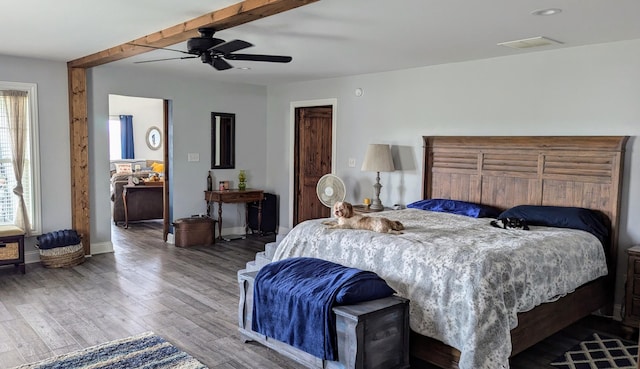 bedroom featuring ceiling fan and wood-type flooring