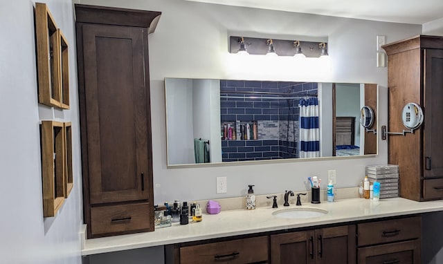 bathroom with vanity and curtained shower