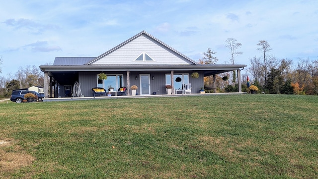 view of front of property featuring covered porch and a front yard