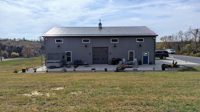 back of house featuring a patio and a yard