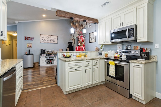 kitchen with stainless steel appliances, kitchen peninsula, dark hardwood / wood-style floors, crown molding, and light stone countertops