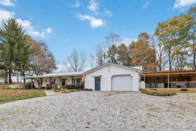 ranch-style home featuring a garage and a porch