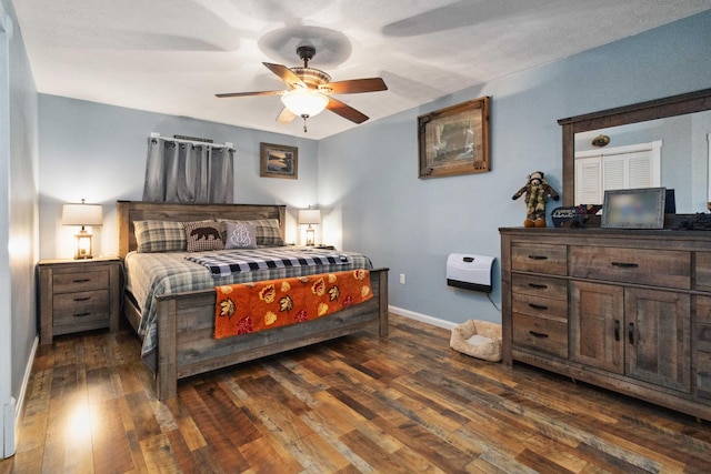 bedroom featuring ceiling fan and dark hardwood / wood-style floors