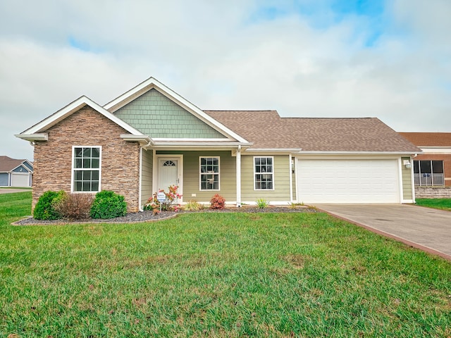 view of front of home featuring a front lawn and a garage