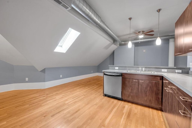 kitchen featuring ceiling fan, sink, decorative light fixtures, dishwasher, and light hardwood / wood-style floors