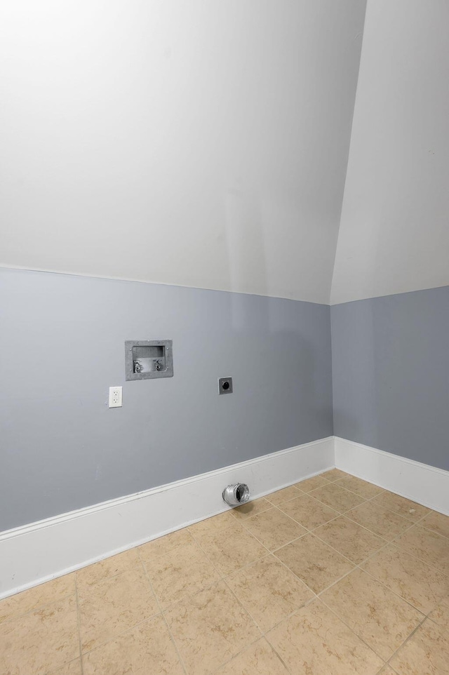 laundry area with hookup for an electric dryer, washer hookup, and tile patterned flooring