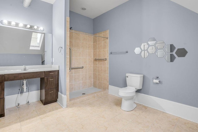 bathroom with tiled shower, tile patterned floors, vanity, and toilet