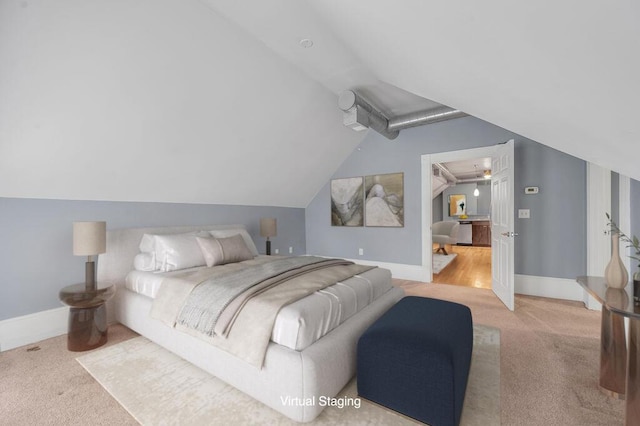 bedroom with carpet flooring and lofted ceiling