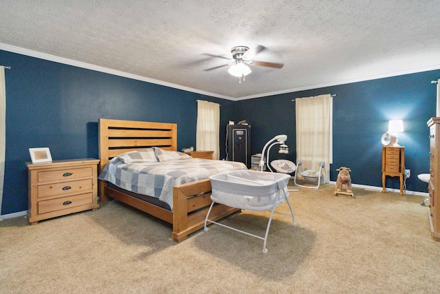 carpeted bedroom with ceiling fan, a textured ceiling, and crown molding