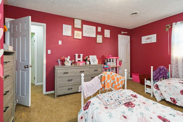 carpeted bedroom with a textured ceiling