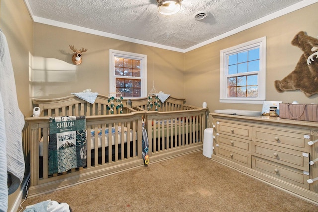 bedroom featuring a textured ceiling, crown molding, and carpet floors