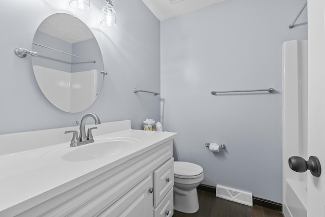 full bathroom featuring vanity, wood-type flooring, bathing tub / shower combination, and toilet