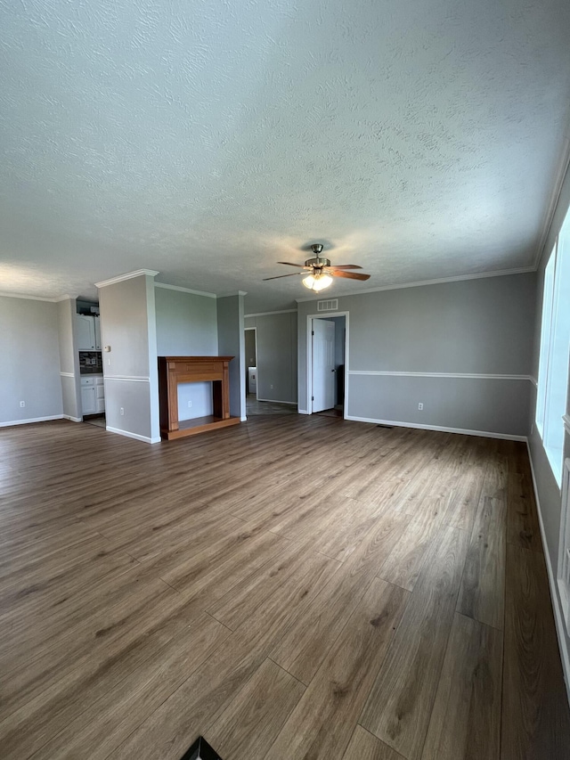 1455 Nepton Rd, Ewing, KY 41039 - unfurnished living room featuring dark wood-style floors, baseboards, a textured ceiling, a ceiling fan, and ornamental molding