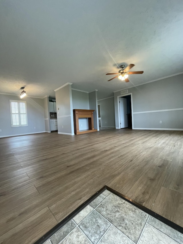1455 Nepton Rd, Ewing, KY 41039 - unfurnished living room featuring ceiling fan, baseboards, dark wood finished floors, and crown molding