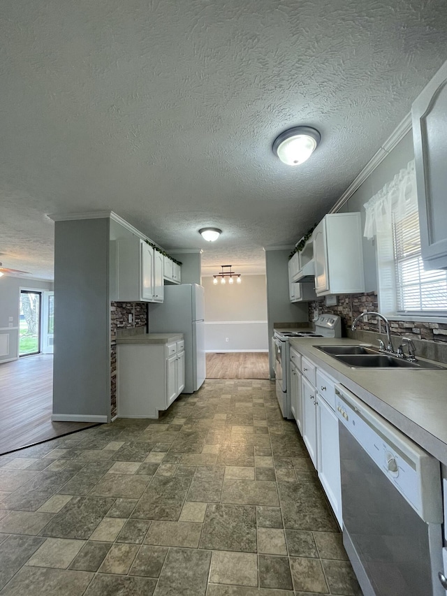 1455 Nepton Rd, Ewing, KY 41039 - kitchen featuring white appliances, a sink, backsplash, white cabinets, and crown molding