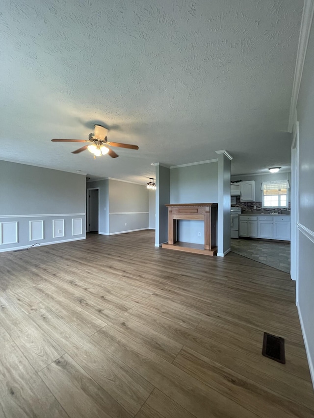 1455 Nepton Rd, Ewing, KY 41039 - unfurnished living room with a ceiling fan, dark wood finished floors, a textured ceiling, a fireplace, and baseboards
