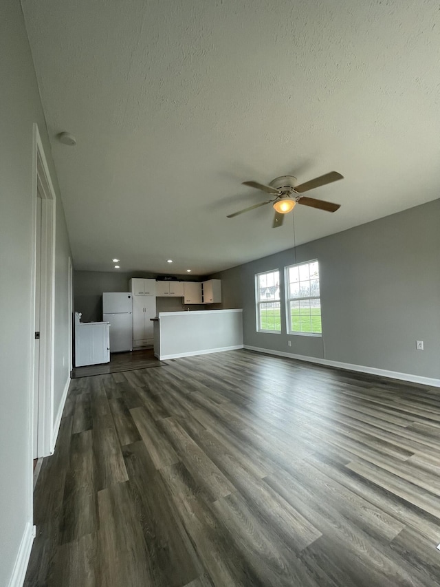 1455 Nepton Rd, Ewing, KY 41039 - unfurnished living room featuring a ceiling fan, baseboards, dark wood-style flooring, a textured ceiling, and recessed lighting