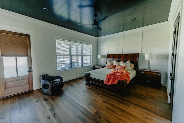 bedroom with hardwood / wood-style floors, wooden ceiling, ceiling fan, and crown molding