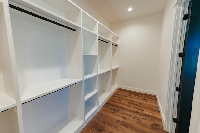 walk in closet featuring dark wood-type flooring