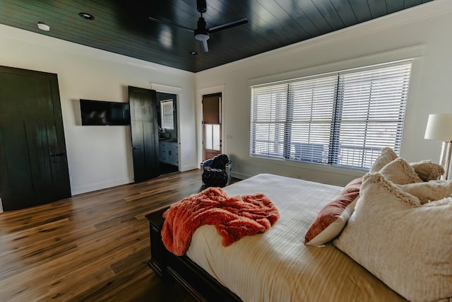 bedroom with dark hardwood / wood-style floors, ceiling fan, wood ceiling, and ornamental molding